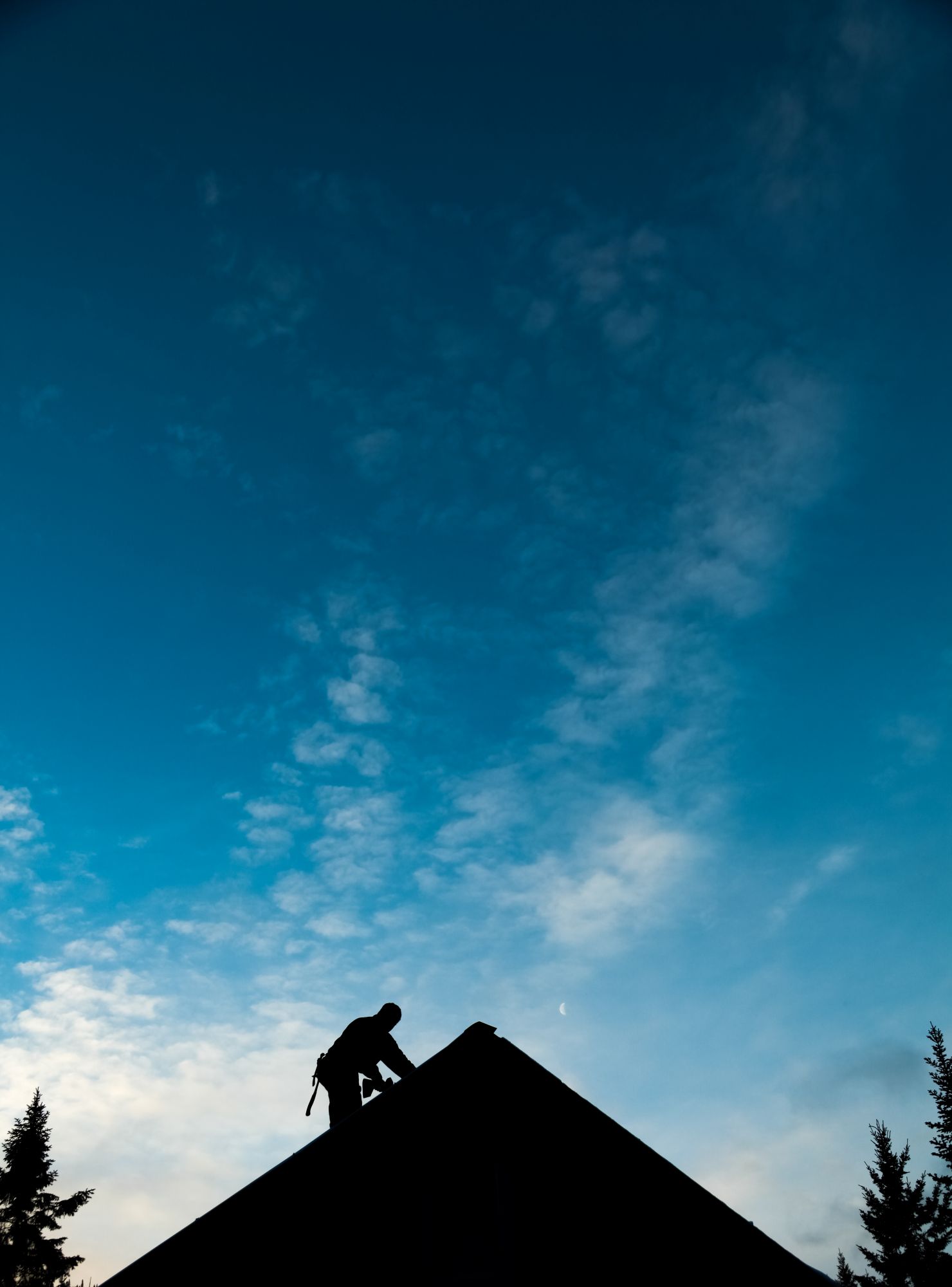 Professional roofer working on a roof